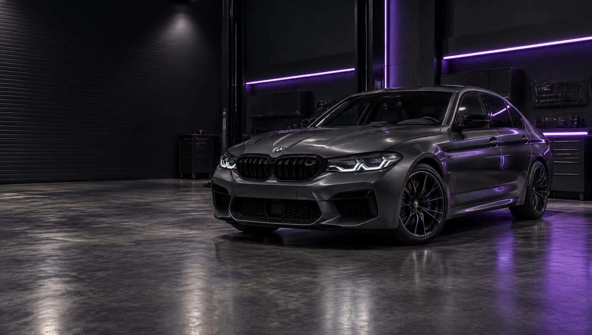 Graphite performance saloon in a specialist tuning workshop